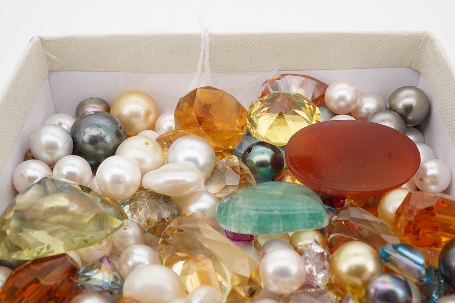 A quantity of assorted loose cultured pearls and unmounted cut gemstones.